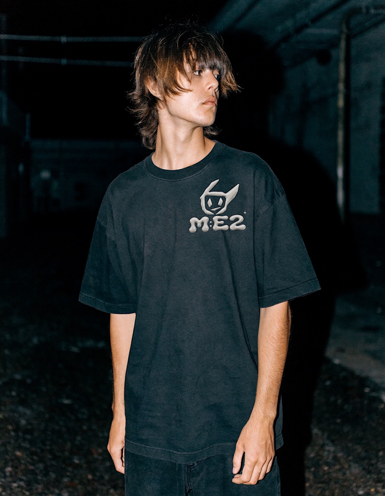 Front view of a black M:E2 shirt